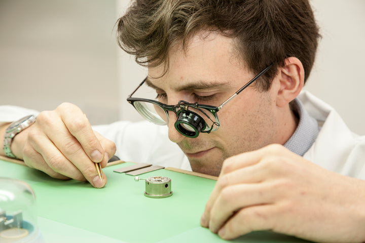 Our watchmaker repairing a watch