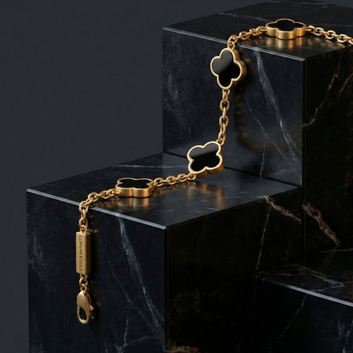 Steel and Barnett Lucky Clover Black Onyx Charm Bracelet In 18ct Plated Gold - Michael Jones Jeweller