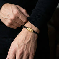 Steel and Barnett Luke Landon Thin Braided Black Leather Men's Bracelet with a Plated 18ct Yellow Clasp - Medium