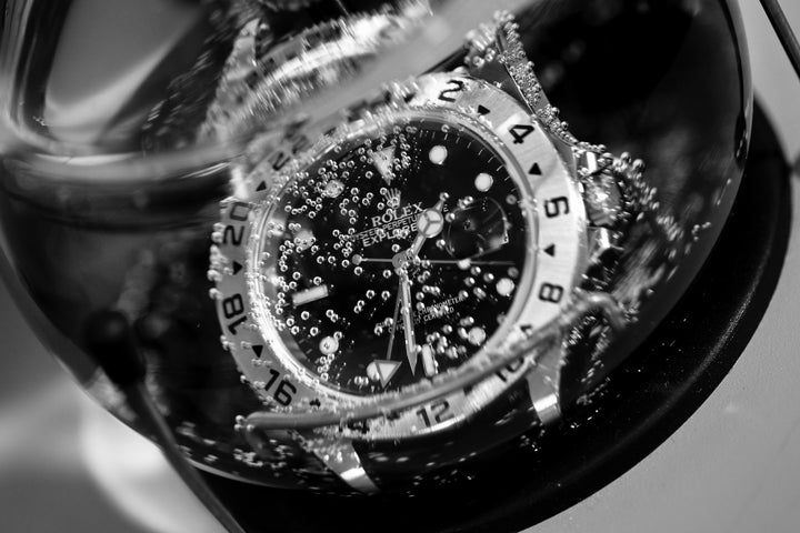 Rolex Watch in a pressure testing chamber with bubbles