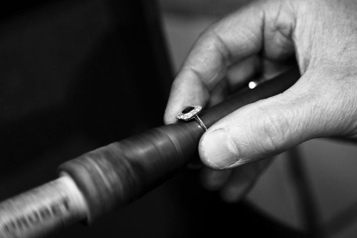 Goldsmith working on sizing a ring