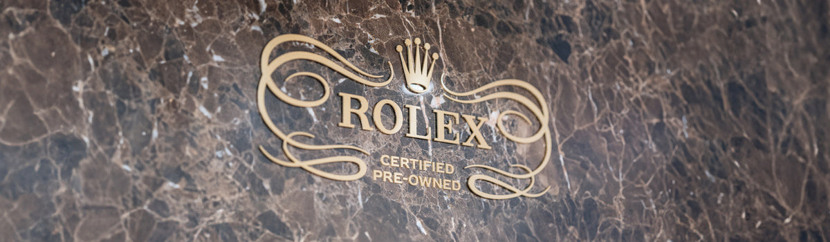 Rolex logo on a marble background