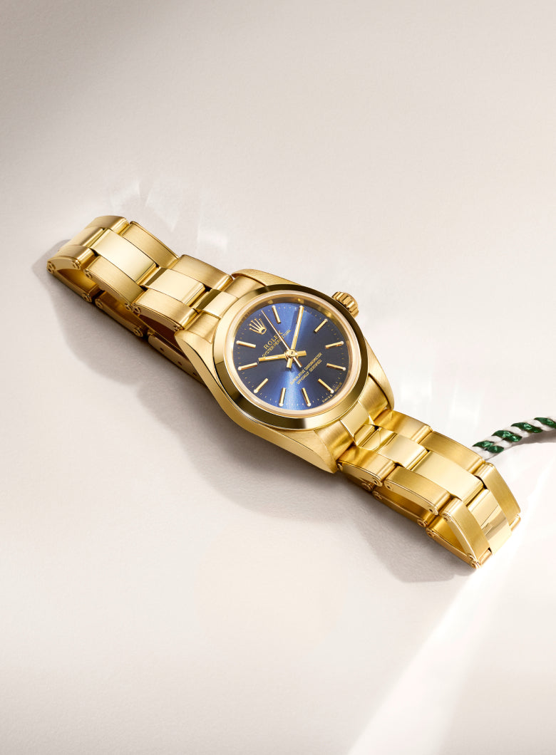 Rolex Certified Pre-Owned watch with a close up of the official swing tag.