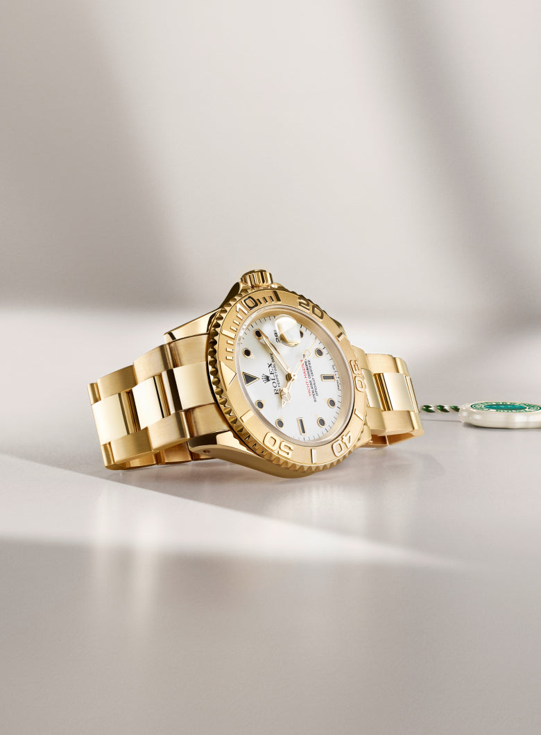 Rolex wristwatch with a white face on a light gray background