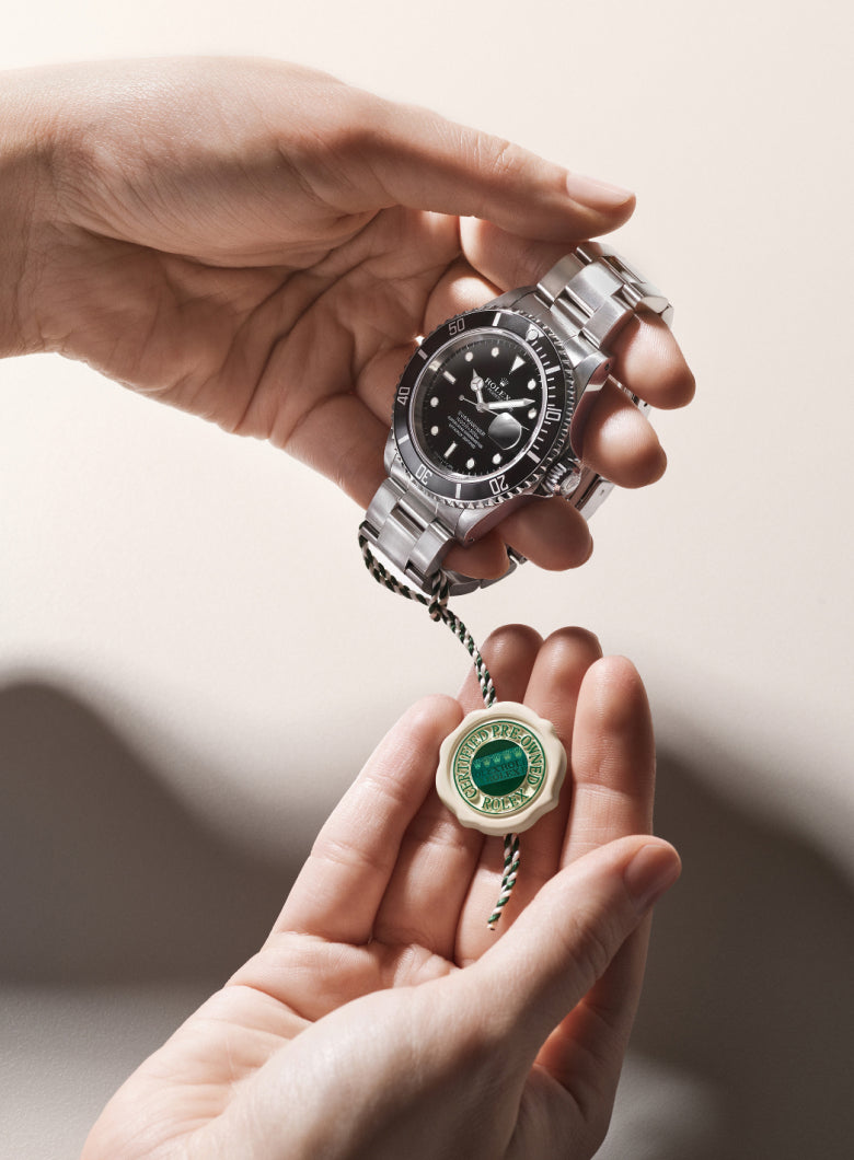 Rolex Certified Pre-Owned watch with a close up of the official swing tag.