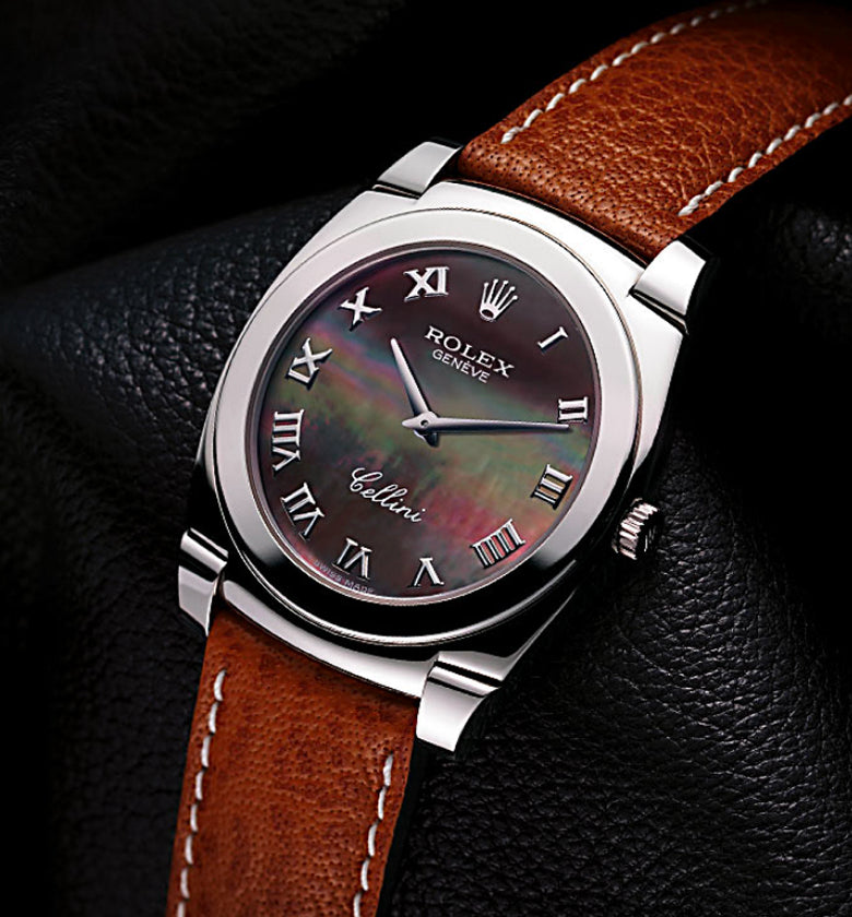 Rolex Cellini watch with brown leather strap on a dark background