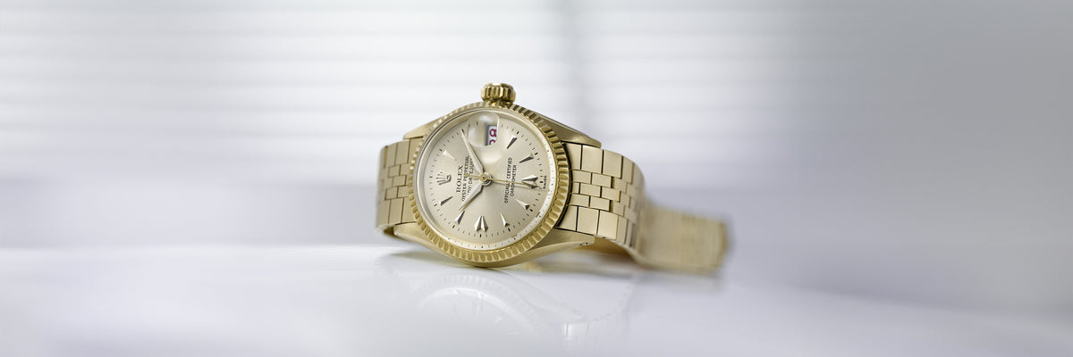 Rolex Lady-Datejust Gold wristwatch on a white background