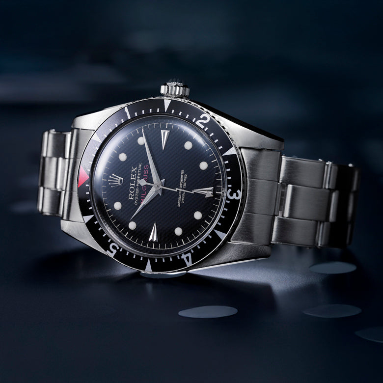 Rolex Milgauss watch with black dial on a dark background