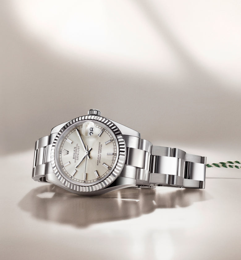 Rolex wristwatch with a detailed face on a light background