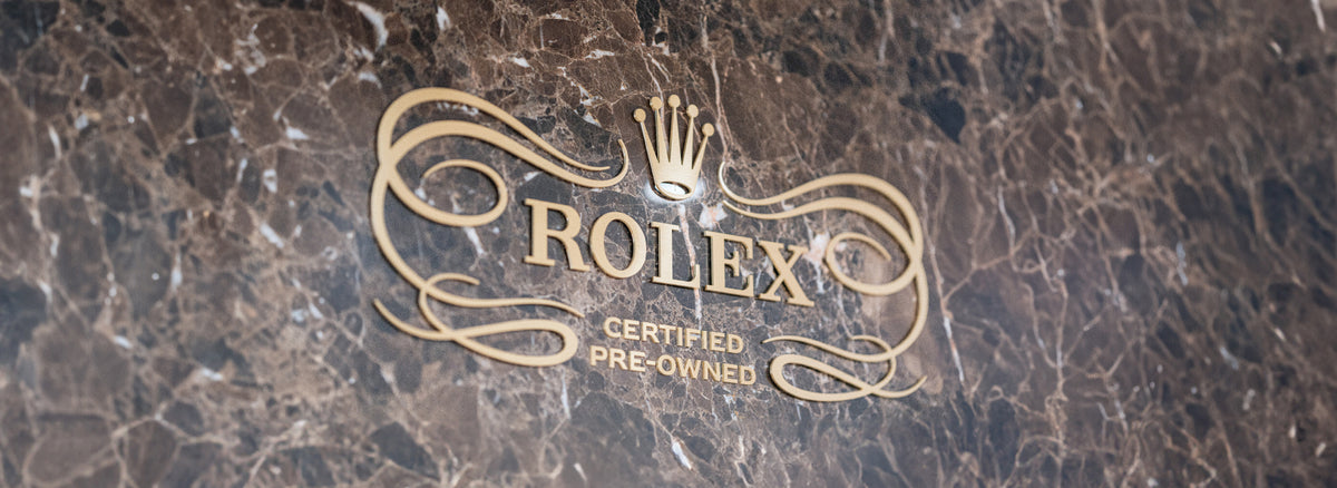 Rolex logo on a marble surface