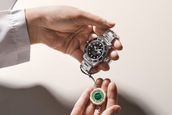 Rolex Certified Pre-Owned watch with a close up of the official swing tag.