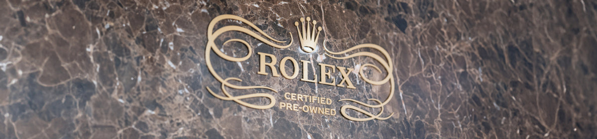 Rolex logo on a textured surface