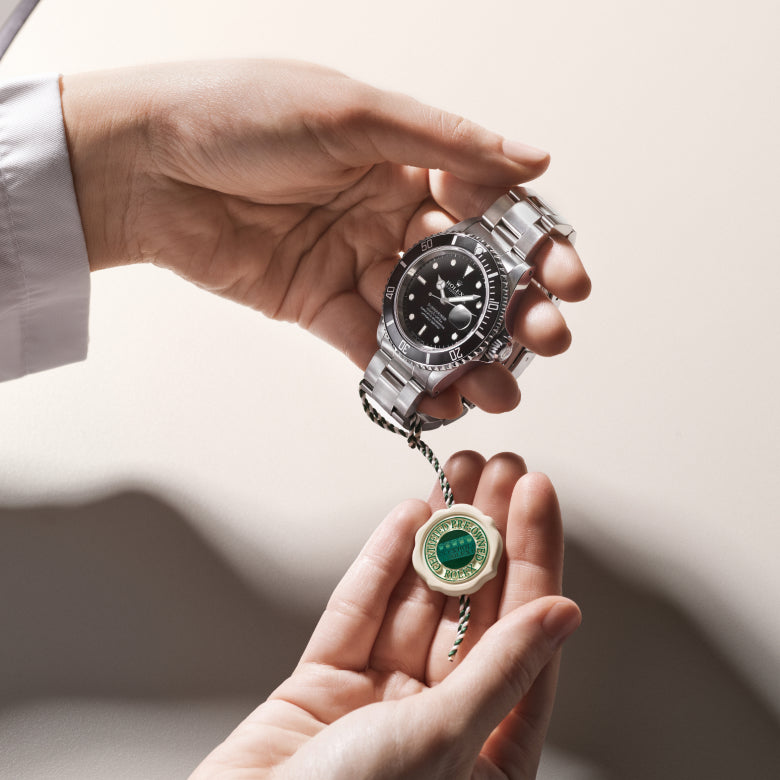 Rolex Certified Pre-Owned watch with a close up of the official swing tag.