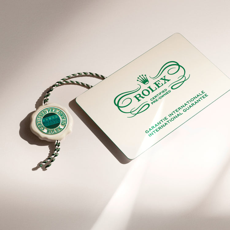 Rolex Certified Pre-Owned watch guarantee card and swing tag